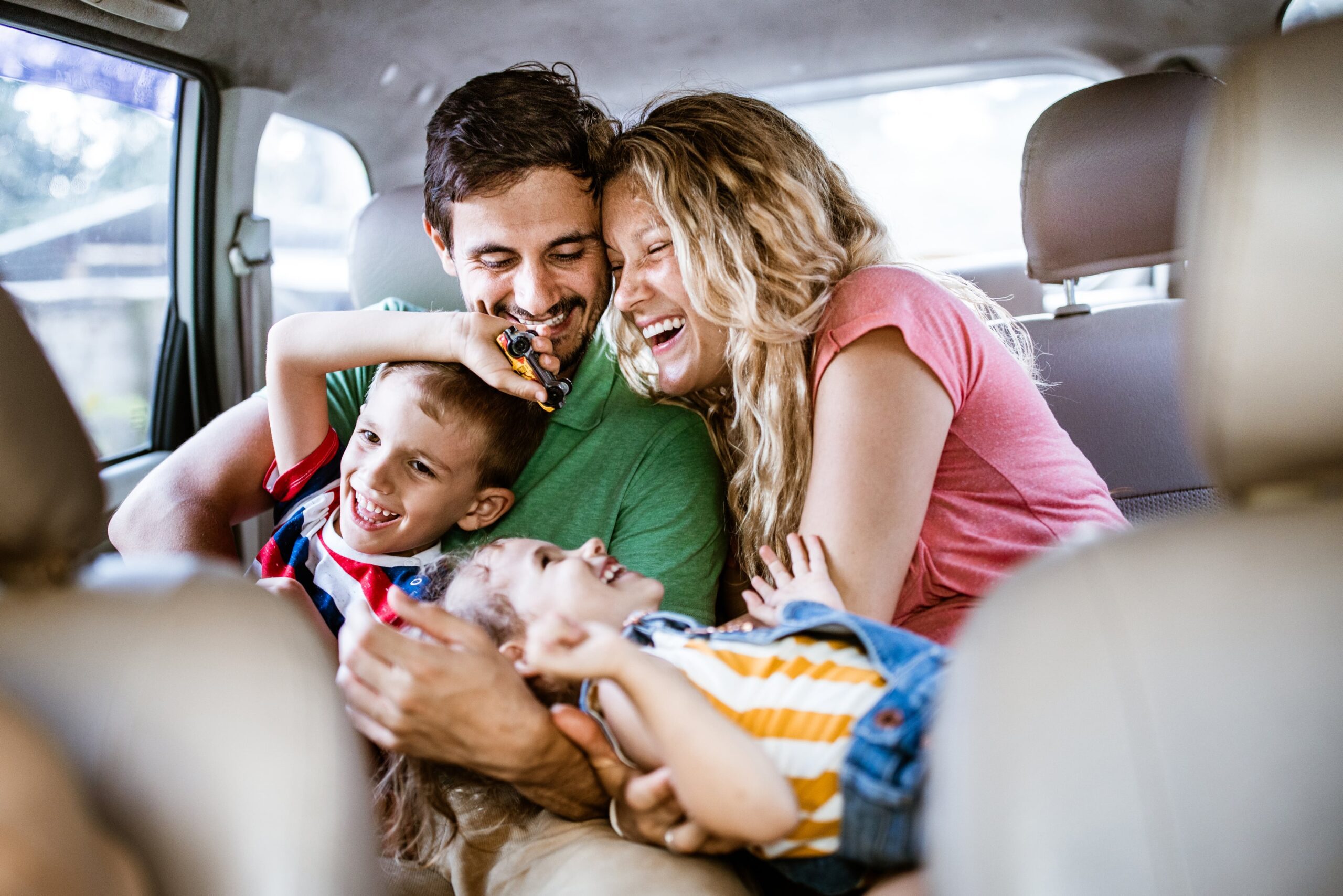 family in back of taxi travelling to heathrow airport
